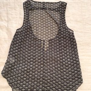 Sheer, cut out back, sleeveless blouse